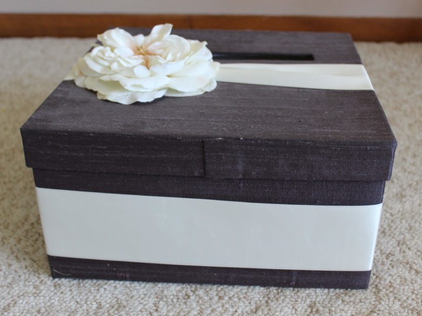 purple card box with ivory ribbon and flower