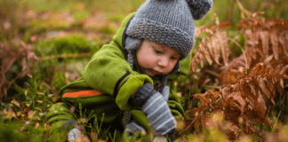 little kid playing in nature